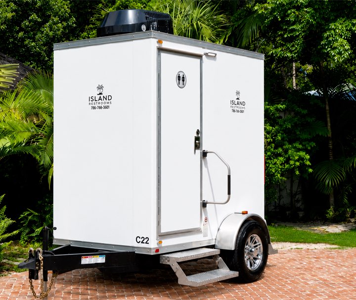 Island Restrooms Compact Luxe restroom trailer with private entry door and steps